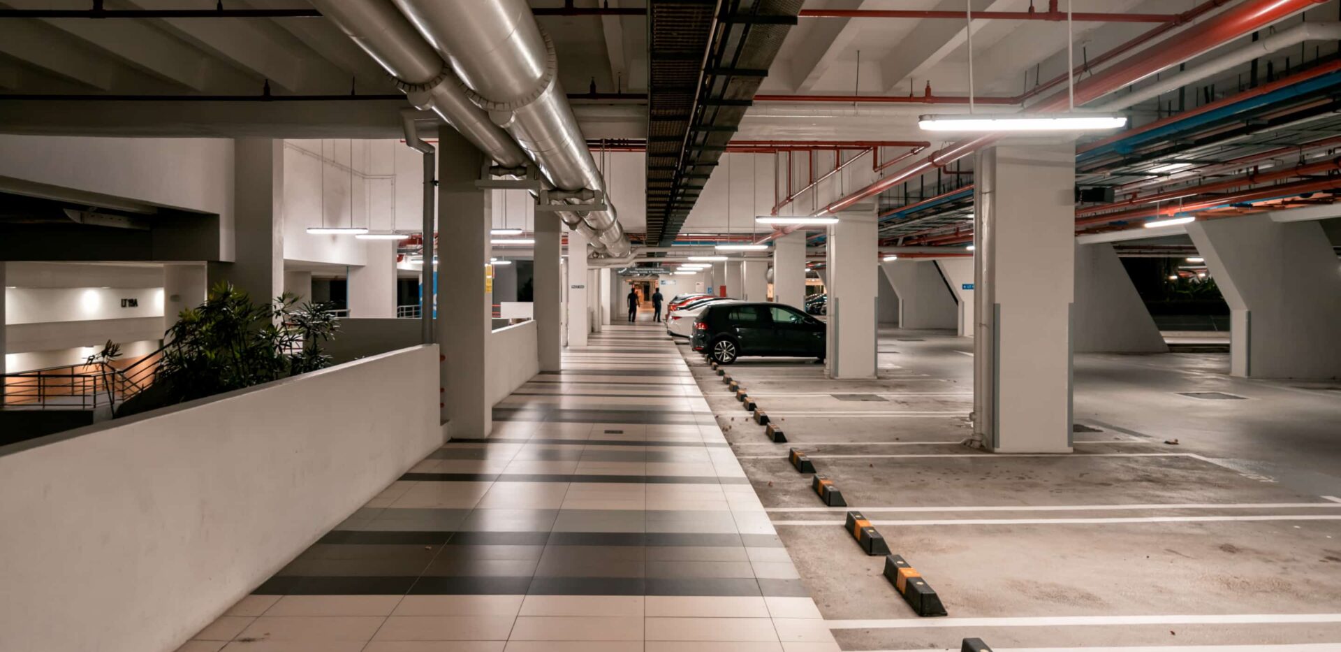 Omnie cleaning a car parking area